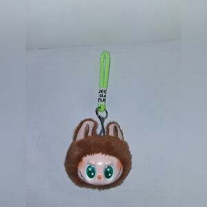 The Minster Bag Charm With Wrist Strap